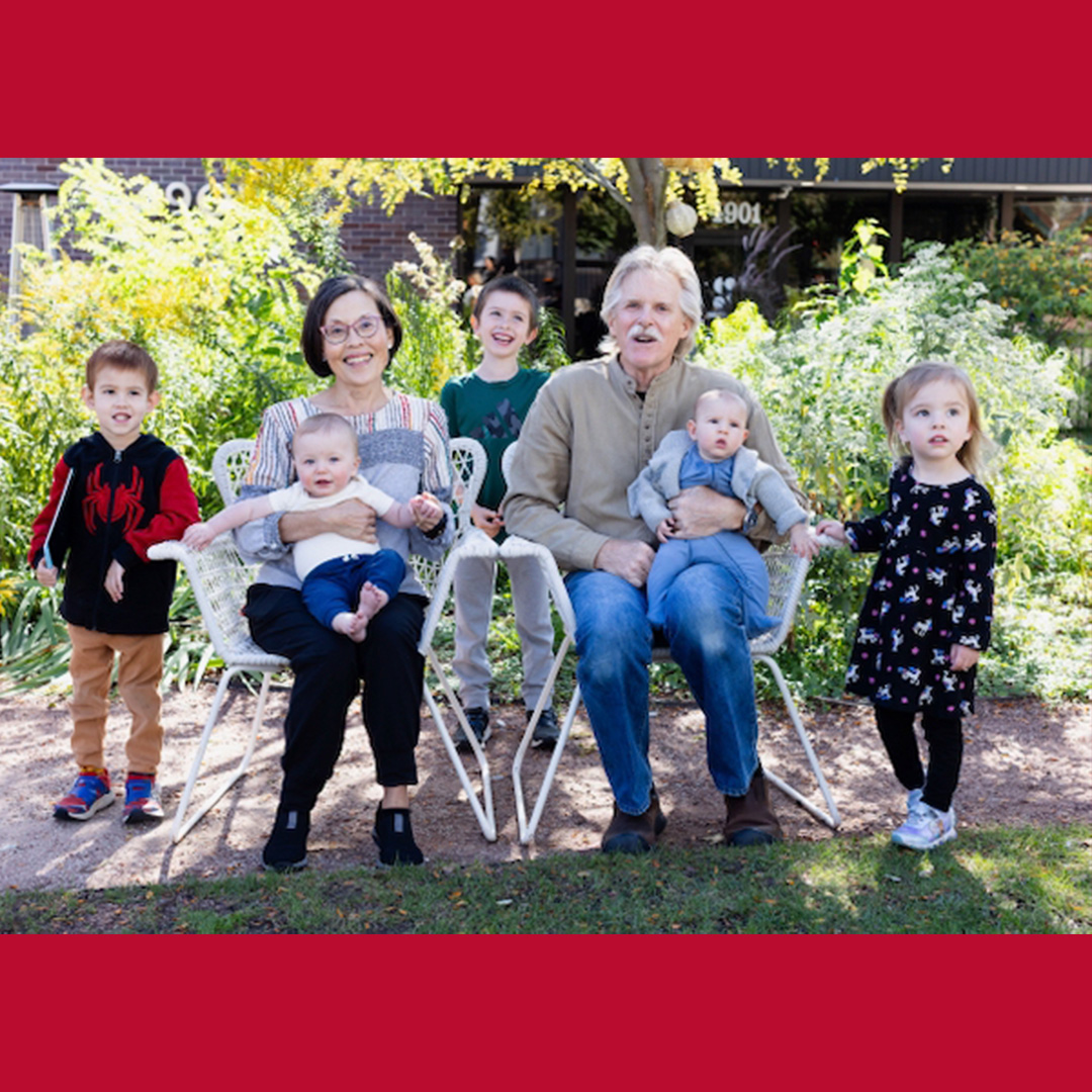 Recent photo of Kevin and Janet with their grandchildren at Kevin's retirement party