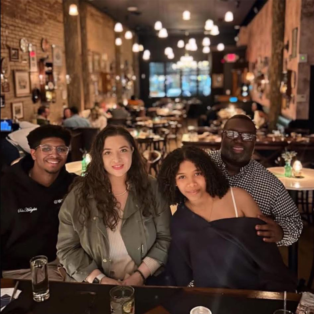 Recent photo of Jessica and Dee with their children at a restaurant