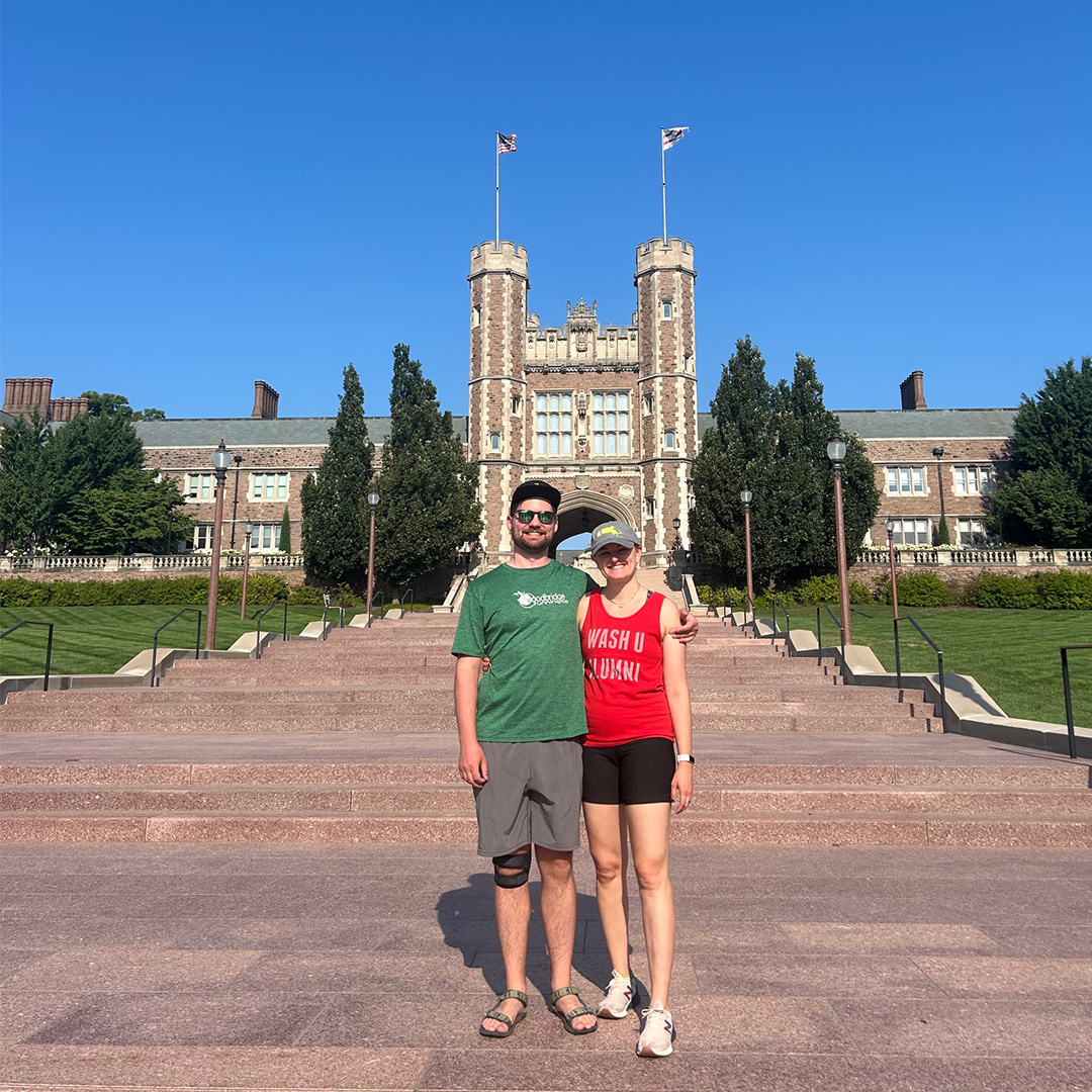 Lacey and Erich pose on the WashU Brookings Hall steps during a campus visit in 2024