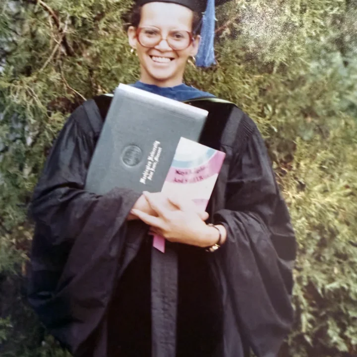 Janice Van Buren holding her diploma